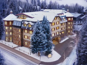 Vail Colorado in December with snow-covered trees and Christmas lights